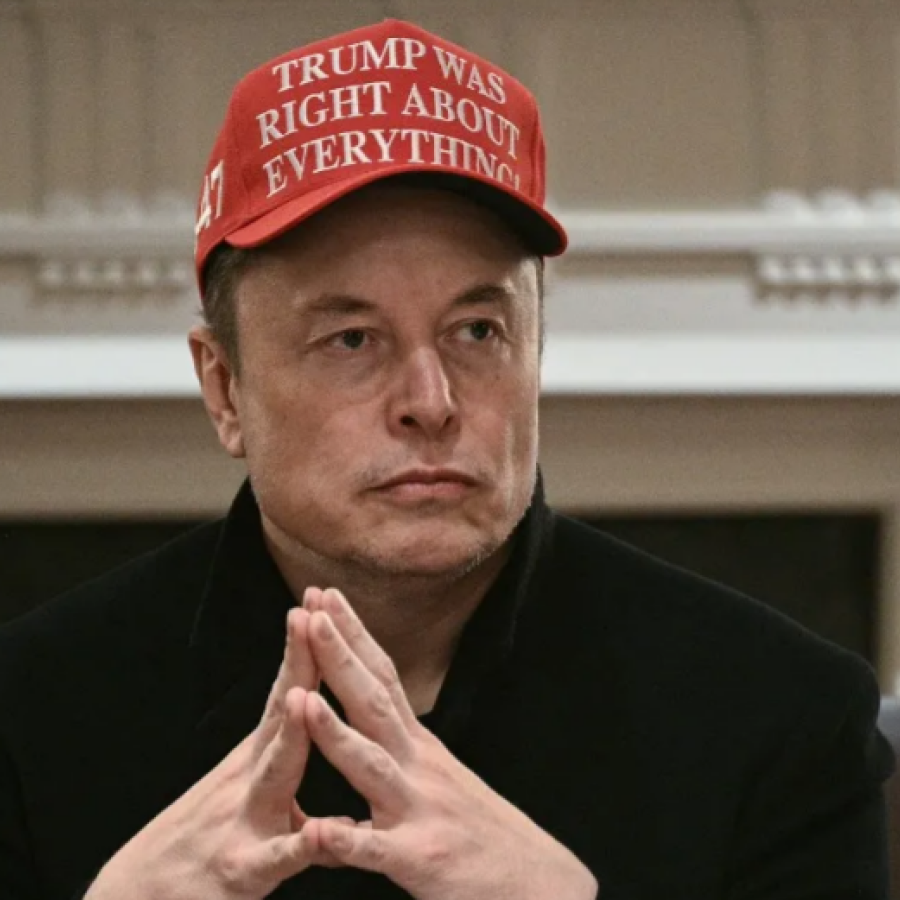 Elon Musk looks on during a cabinet meeting hosted by  Trump