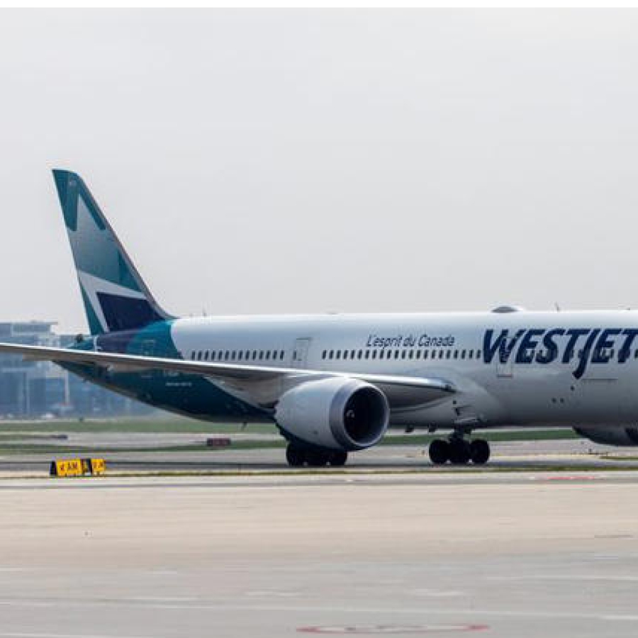 A WestJet Boeing 787-9 Dreamliner airplane taxis along a runway at Toronto Pearson